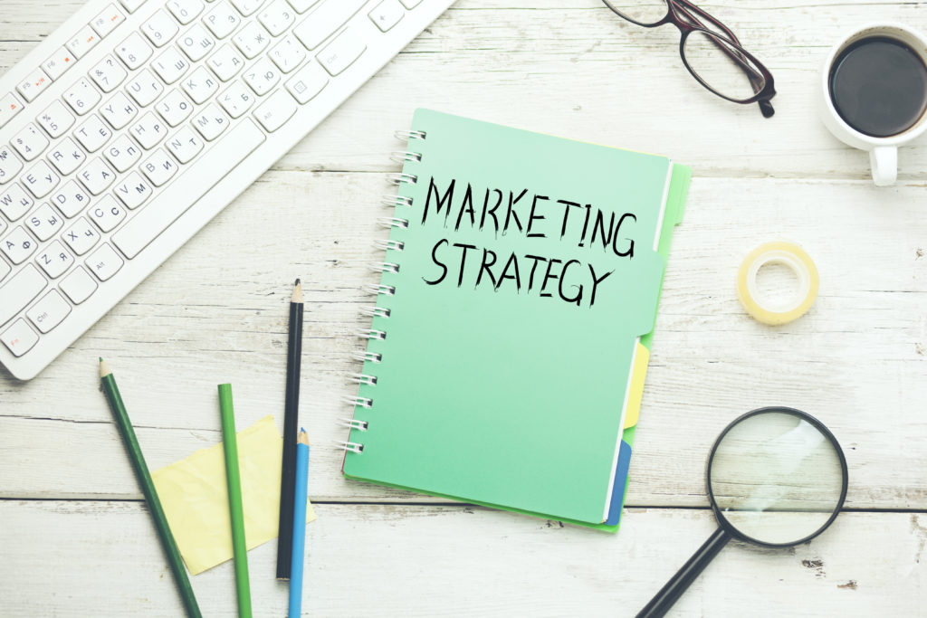 marketing strategy text on notebook