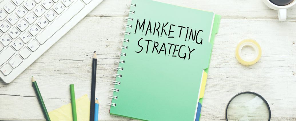 marketing strategy text on notebook