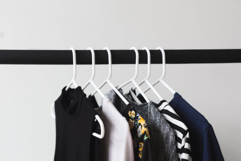 Black and white clothing on rack